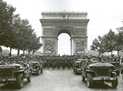 GIs parade through the Arc de Triumph in Paris